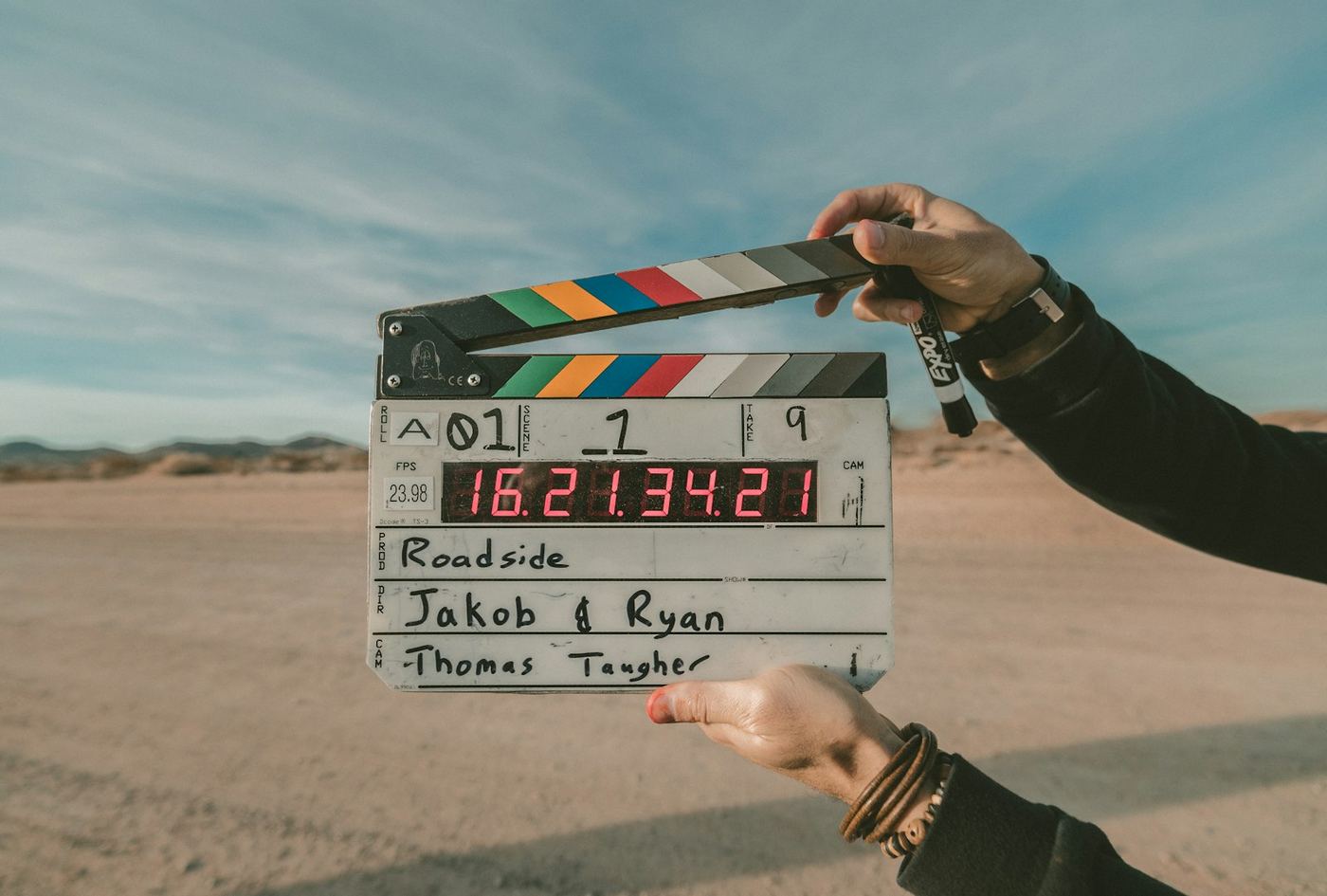 Film production crew working with a camera on set